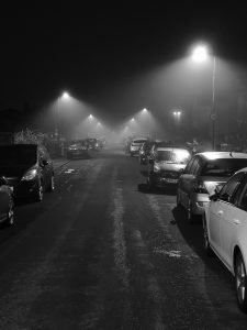 streetlights on misty street