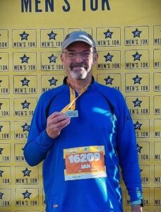 Me after 10k with medal